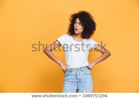 Stock photo: Portrait Of A Doubtful Girl Looking Away At Copy Space