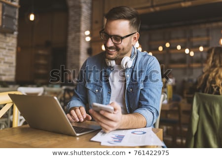 Stockfoto: Man With Laptop Calling By Phone