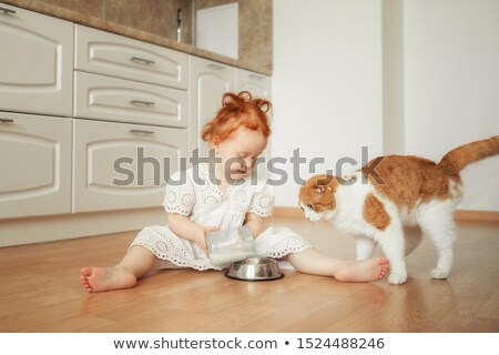 ストックフォト: Happy Owner Petting Her Cat Drinking Milk