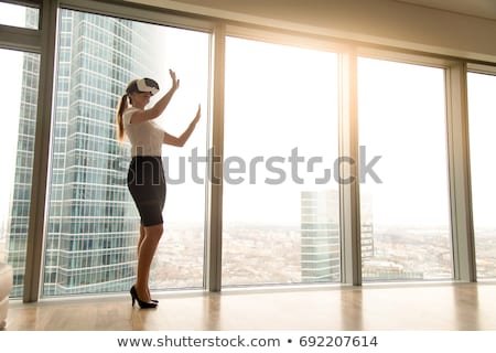 [[stock_photo]]: Woman In Virtual Reality Headset Shopping Online