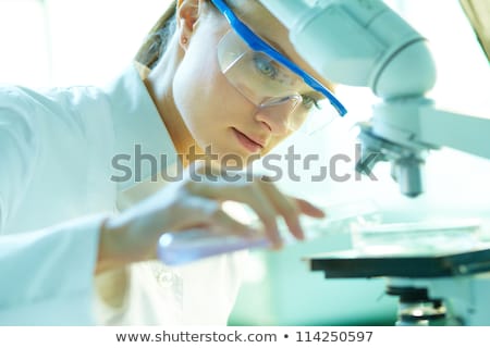 Stock photo: Beautiful Female Biotechnology Scientist Chemist Working In Lab