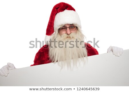 Stock foto: Portrait Of Funny Santa Claus Holding Billboard Winking