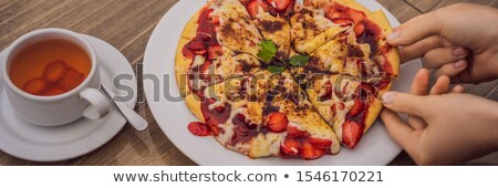 Stock foto: Woman Eating Delicious Strawberry Pizza On A Balinese Tropical Nature Background Bali Island Indon