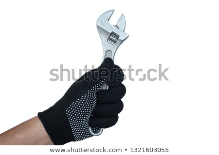 Stockfoto: Repairman Holding Adjustable Wrench