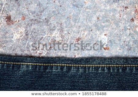 Stockfoto: Fragment Of Dark Blue Jeans On White Background