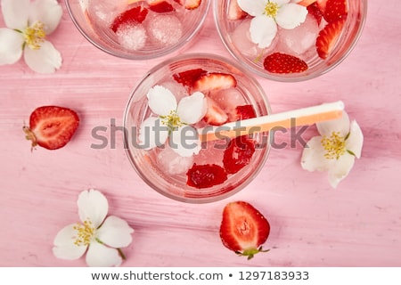 Foto d'archivio: Strawberry Detox Water With Jasmine Flower Summer Iced Drink Or Tea