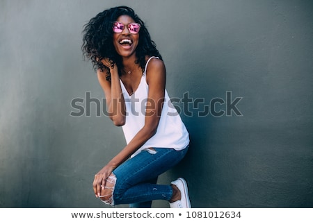 Foto d'archivio: Happy African American Young Woman In Sunglasses