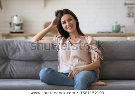 Сток-фото: Shot Of Pleasant Looking Young Brunette Girl Has Good Rest At Home Looks Directly At Camera Has He