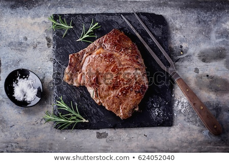 Сток-фото: Grilled Beef Steak Topped With Butter And Rosemary