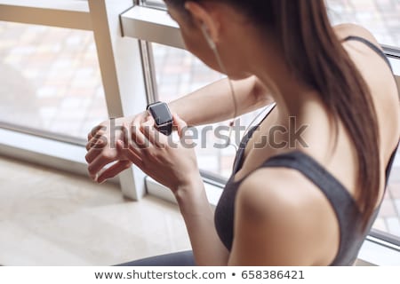 Foto stock: Woman Holding Smart Watch