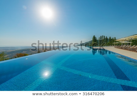 Zdjęcia stock: Infinity Pool On The Bright Summer Day