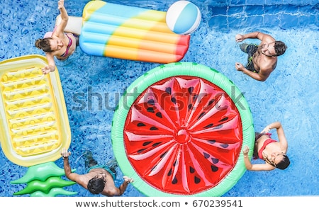 La mujer flota en la piscina Foto stock © DisobeyArt