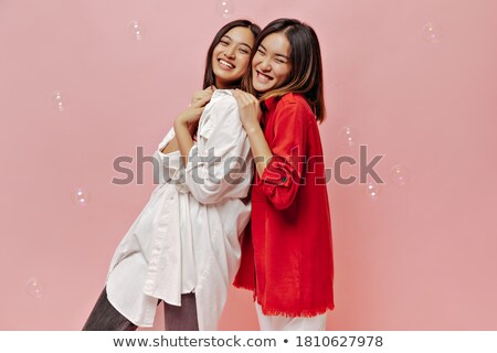 Stok fotoğraf: Cute Smiling Girl In Pink Blouse And Jeans Isolated On White