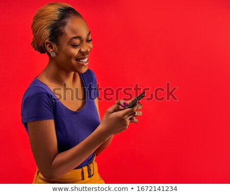 Stock fotó: Portrait Of A Happy Smiling Casual Woman Holding Mobile Phone