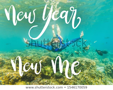 Foto d'archivio: New Year New Me Concept Happy Woman In Snorkeling Mask Dive Underwater With Tropical Fishes In Coral