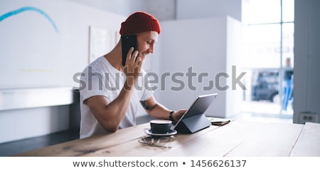 Stock photo: Young Casual Man Speaking On Phone
