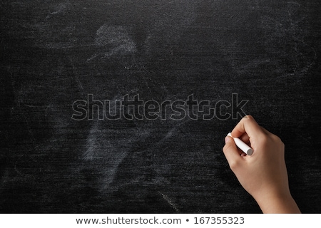 Stok fotoğraf: Hand On Empty Chalkboard