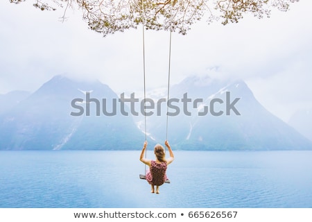 Foto d'archivio: Woman On The Swing