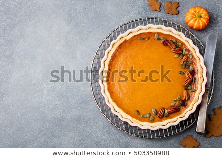 Stockfoto: Pumpkin Pie Tart In A Baking Dish On Cooling Rack