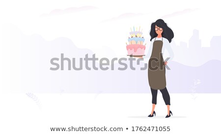 Stock photo: Woman In Apron Holding Plate Of Tempting Pastry