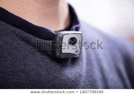Stock photo: Surveillance Camera On Mans T Shirt