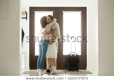 Zdjęcia stock: Man And Woman Hugging In The Doorway