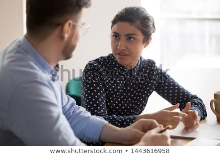 Stok fotoğraf: Business Teamwork Looking At Report And Having A Discussion In O