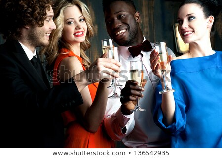 Smart Couple Drinking Champagne At A Party Foto stock © stockyimages