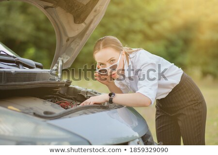 Stock photo: Pretty Young Woman By The Roadside After Her Car Has Broken Down