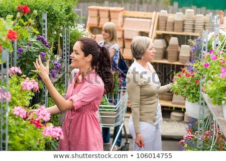 Stock fotó: Woman Shopping For Flowers In Garden Centre Variation Of Plants