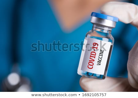 Foto stock: Doctor Holding Coronavirus Vaccine