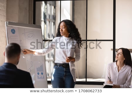 Stock photo: Image Of Multiethnic Young Coworkers Standing By Flipchart In Of