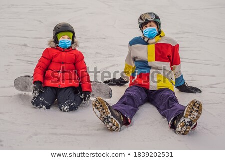 Stok fotoğraf: Dad Teaches Son Snowboarding Activities For Children In Winter Childrens Winter Sport Lifestyle