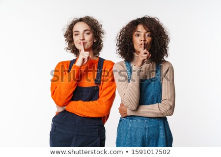 Сток-фото: Portrait Of Curly Multinational Women Gesturing Silence Sign At Camera