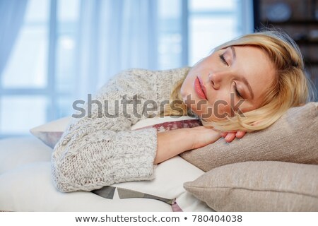 Foto stock: Blonde Girl Napping On Couch