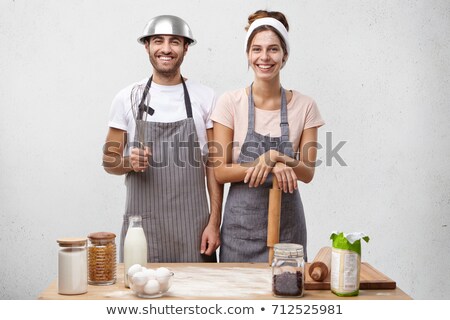 Foto stock: Couple Making A Cake Together