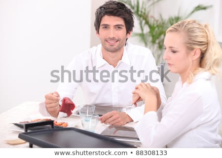 Stock photo: A Couple Eating Meat Cooked On Plancha