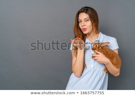 Stok fotoğraf: Woman Wearing Cute Bunny Sending A Kiss