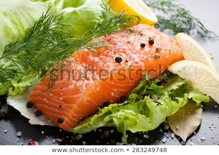 Foto d'archivio: Delicious Portion Of Fresh Salmon Fillet With Aromatic Herbs