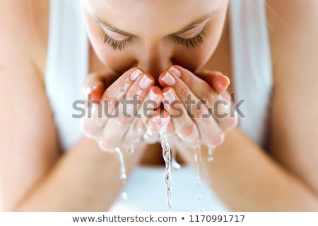 Foto d'archivio: Beautiful Young Woman Washing Her Face