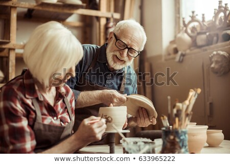 ストックフォト: Male Potters Hand Painting A Bowl