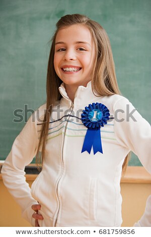 Stock photo: Schoolgirl Wearing A Rosette