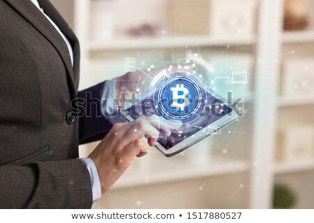 Foto d'archivio: Business Woman Using Tablet In Home Office Mood With Bitcoin Link Network Concept