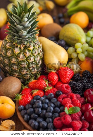 Stockfoto: Fresh Organic Summer Berries Mix In Wooden Tray And Exotic Fruits On Wooden Background Raspberries