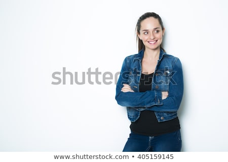 Stockfoto: Body Shot Of A Cheerful Woman In Denim Jacket