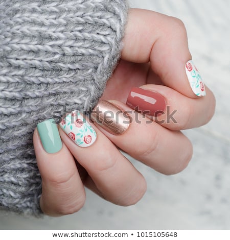 Foto d'archivio: Nail Polish Bottles On Floral Background French Manicure And Cosmetic Branding