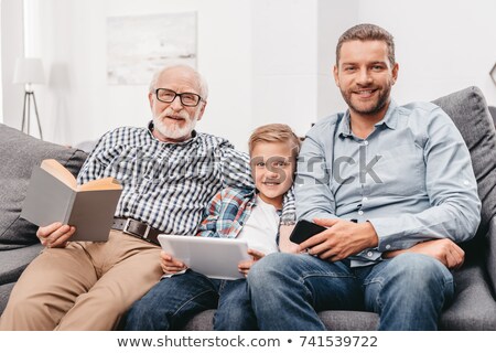 Grandson And Grandfather Connecting A Computer Foto stock © EdBockStock