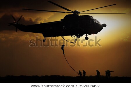 Foto stock: Military Special Forces With A Helicopter