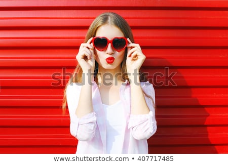 Foto d'archivio: Portrait Of Smiling Attractive Young Woman With Red Lips