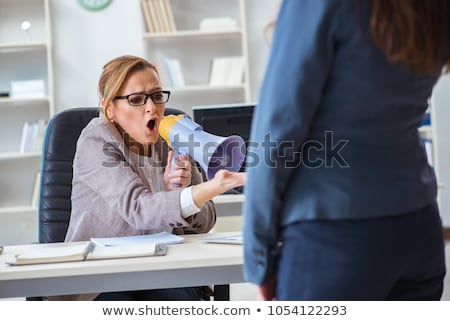 Foto stock: Angry Businesswoman With Loudspeaker